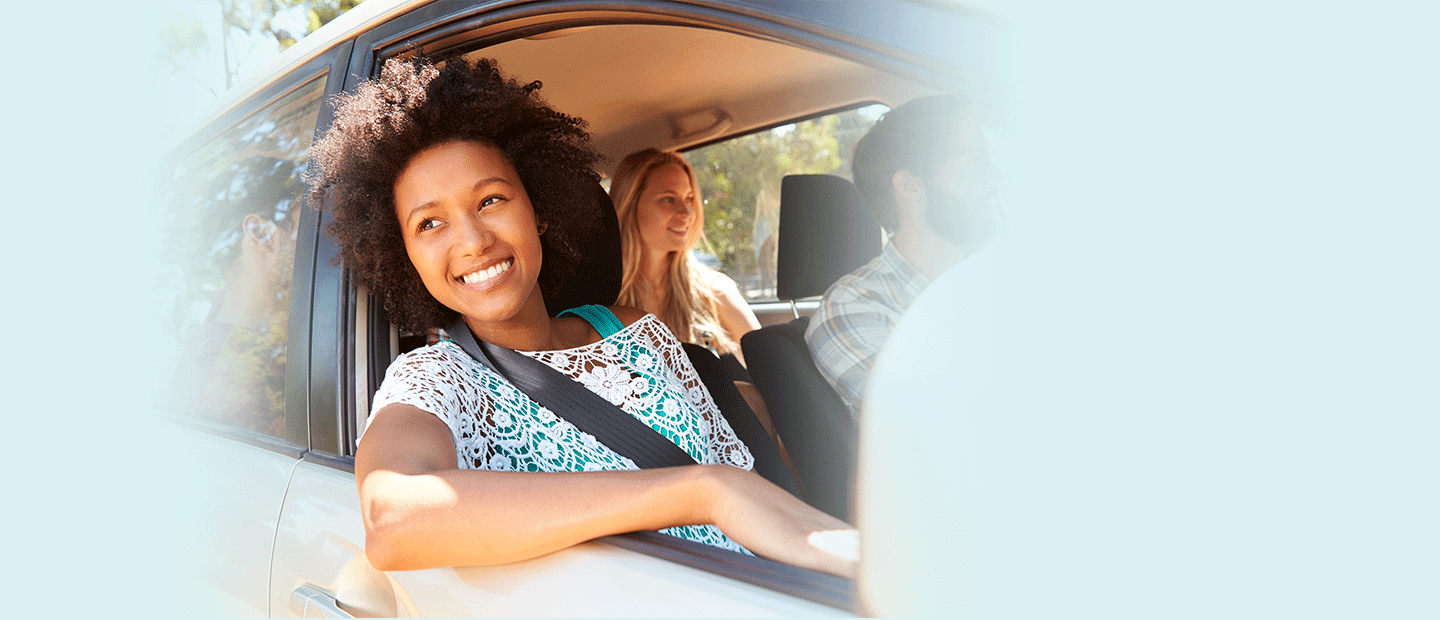 GasBuddy Premium - Apply for Gas Card - Smiling Woman in Car